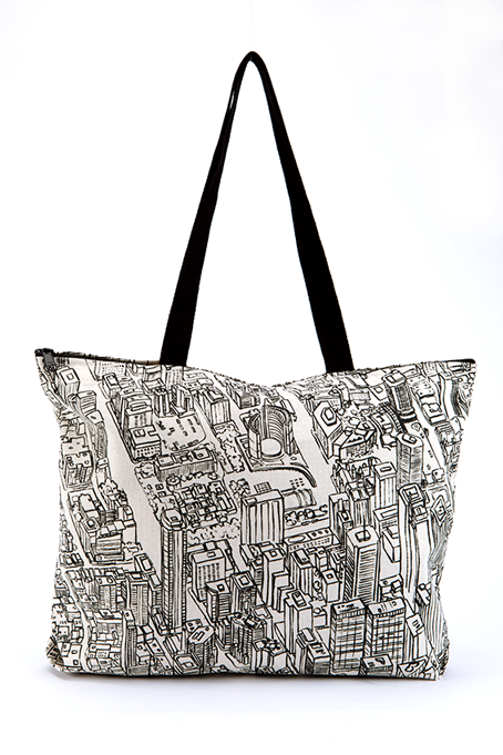 A black and white tote bag with a hand-drawn map of Toronto, featuring the CN Tower and City Hall.