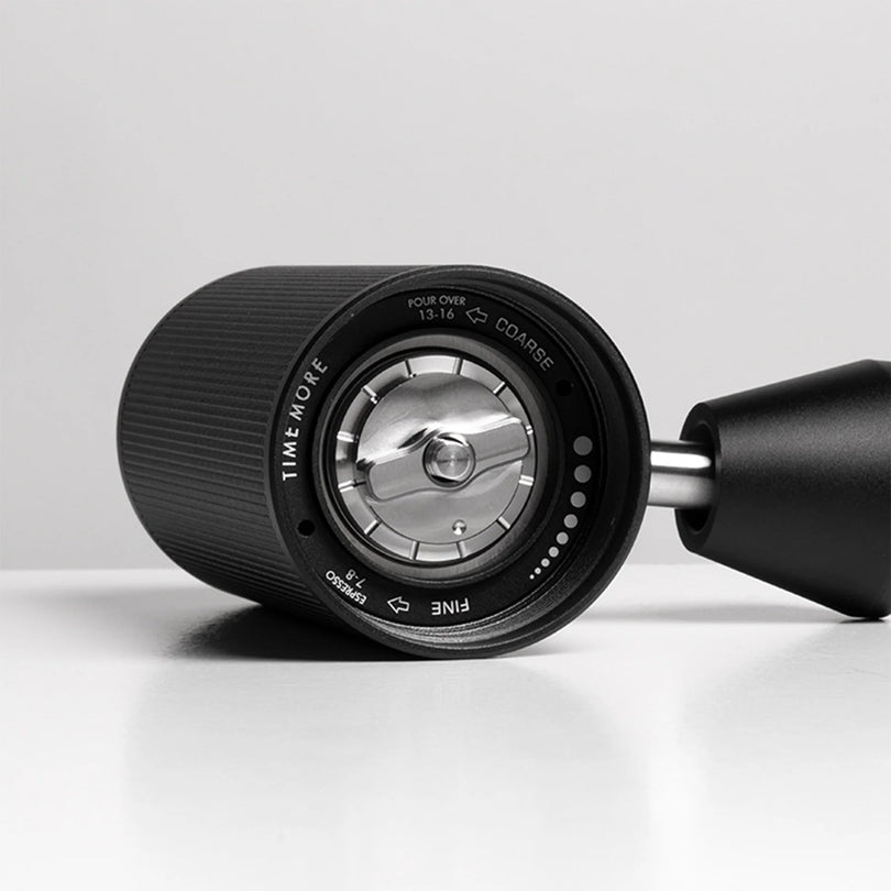 Close-up of Grind adjustment of Timemore grinder on white background