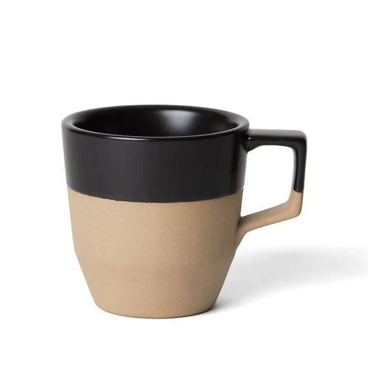Two-toned mug with black top and beige bottom on a white background